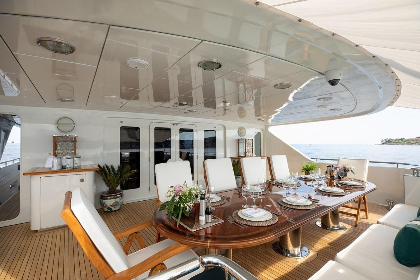 a large room with tables and chairs aboard SIERRA 2 Yacht for Sale