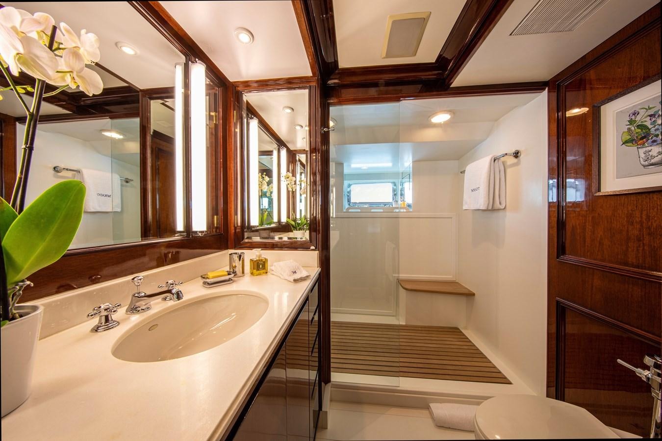 a bathroom with a large mirror aboard MIKADO Yacht for Sale