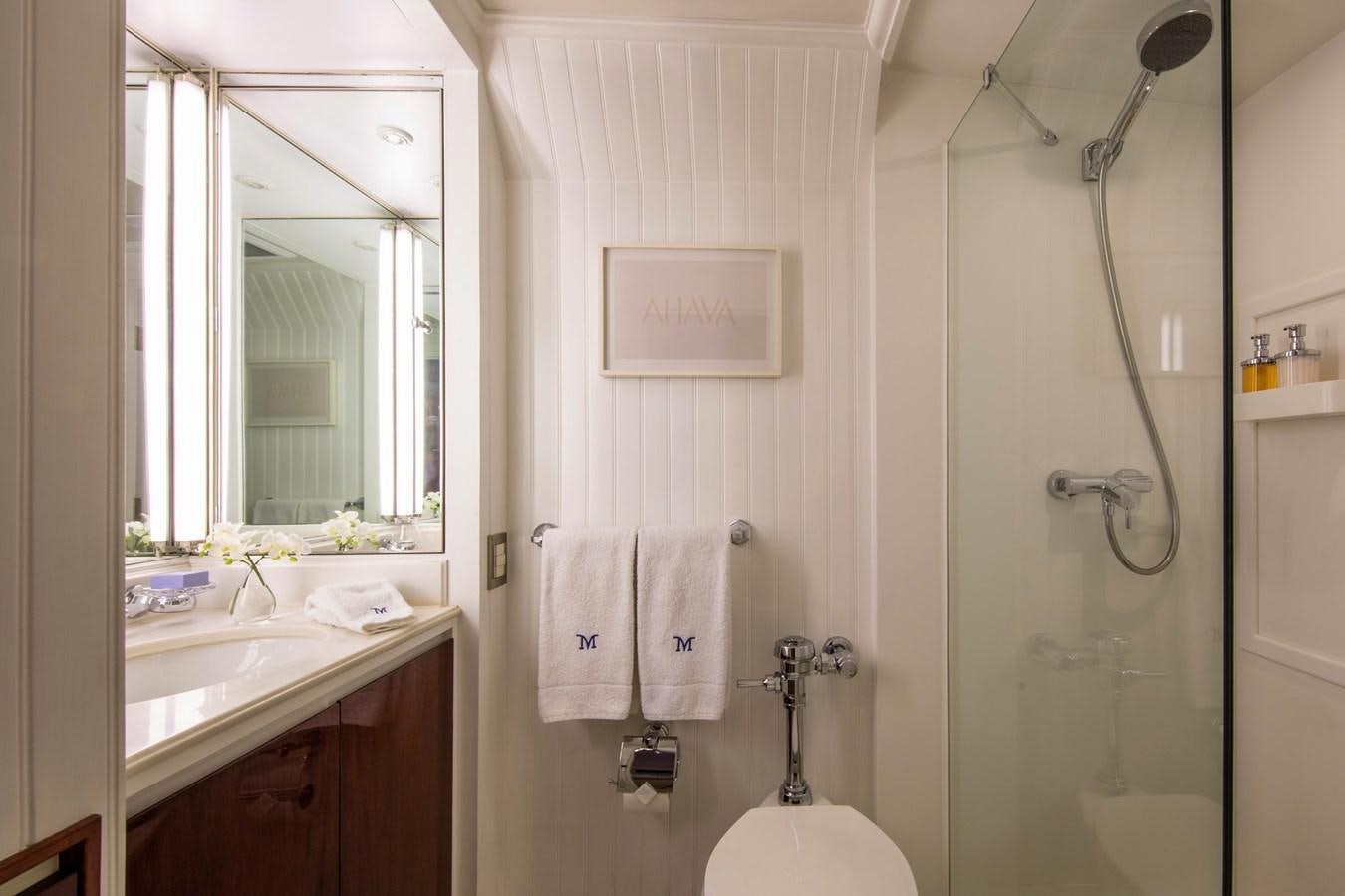 a bathroom with a shower and sink aboard MIKADO Yacht for Sale