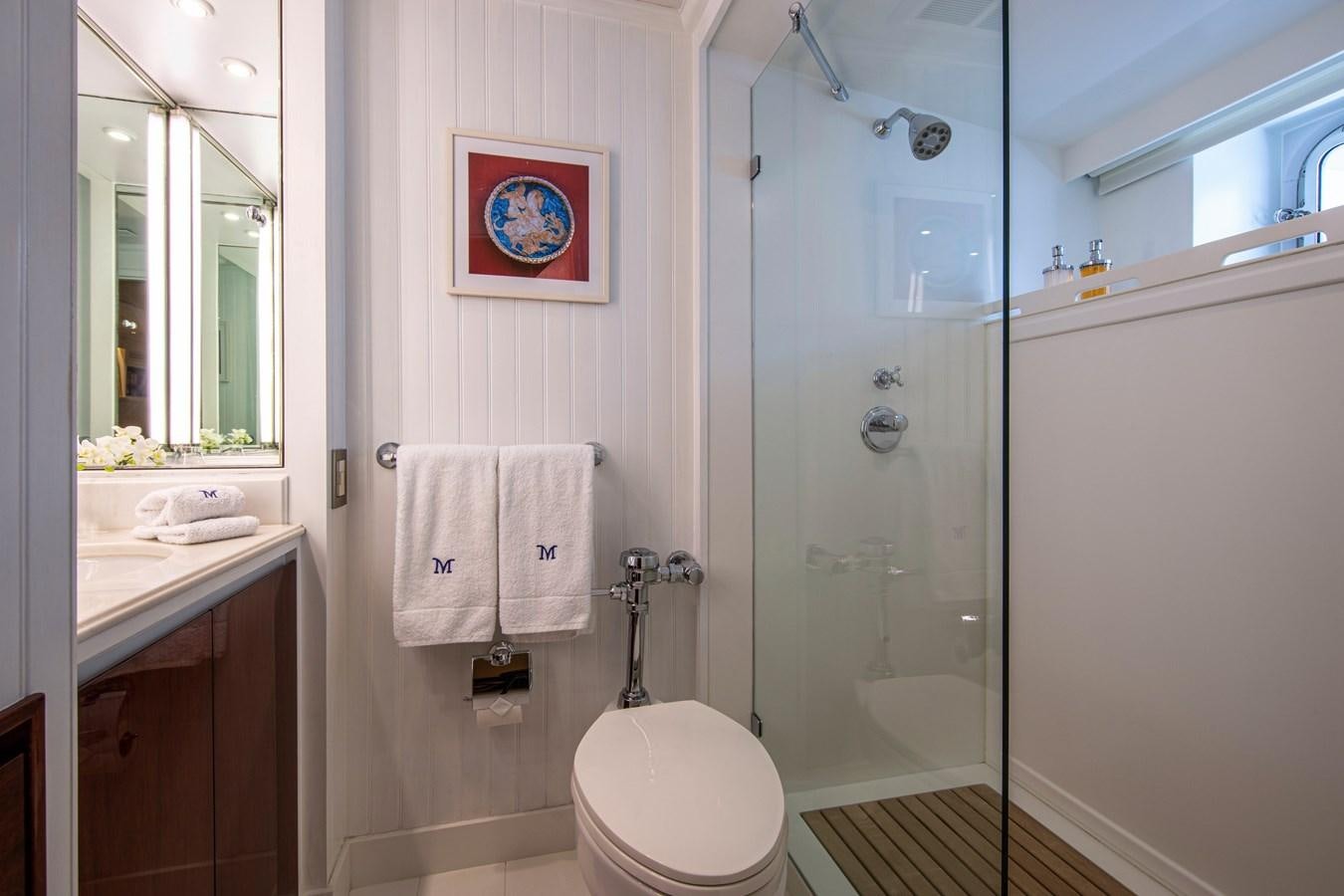 a bathroom with a shower and toilet aboard MIKADO Yacht for Sale