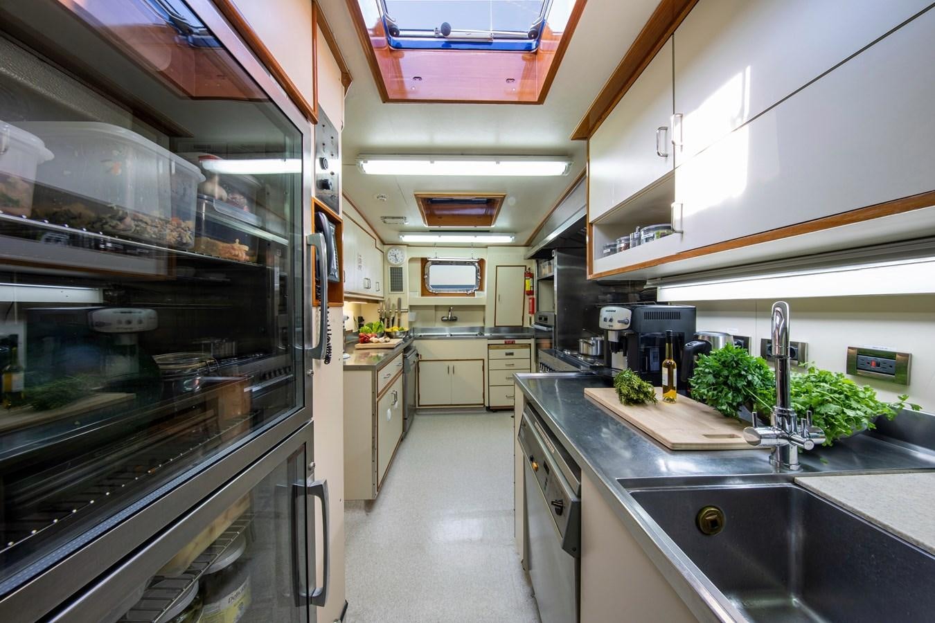 a kitchen with a large oven aboard MIKADO Yacht for Sale
