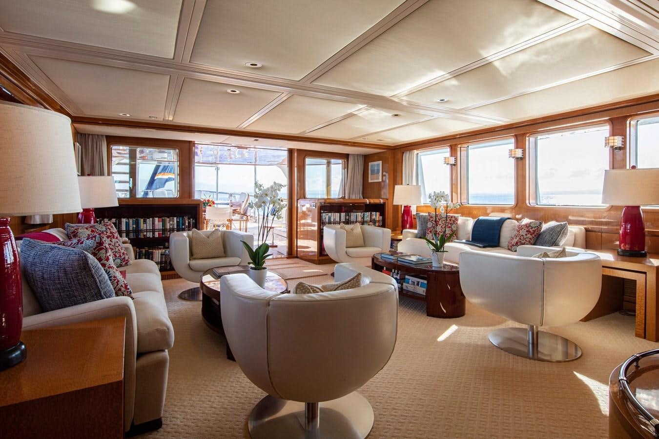 a living room with a large window aboard MIKADO Yacht for Sale