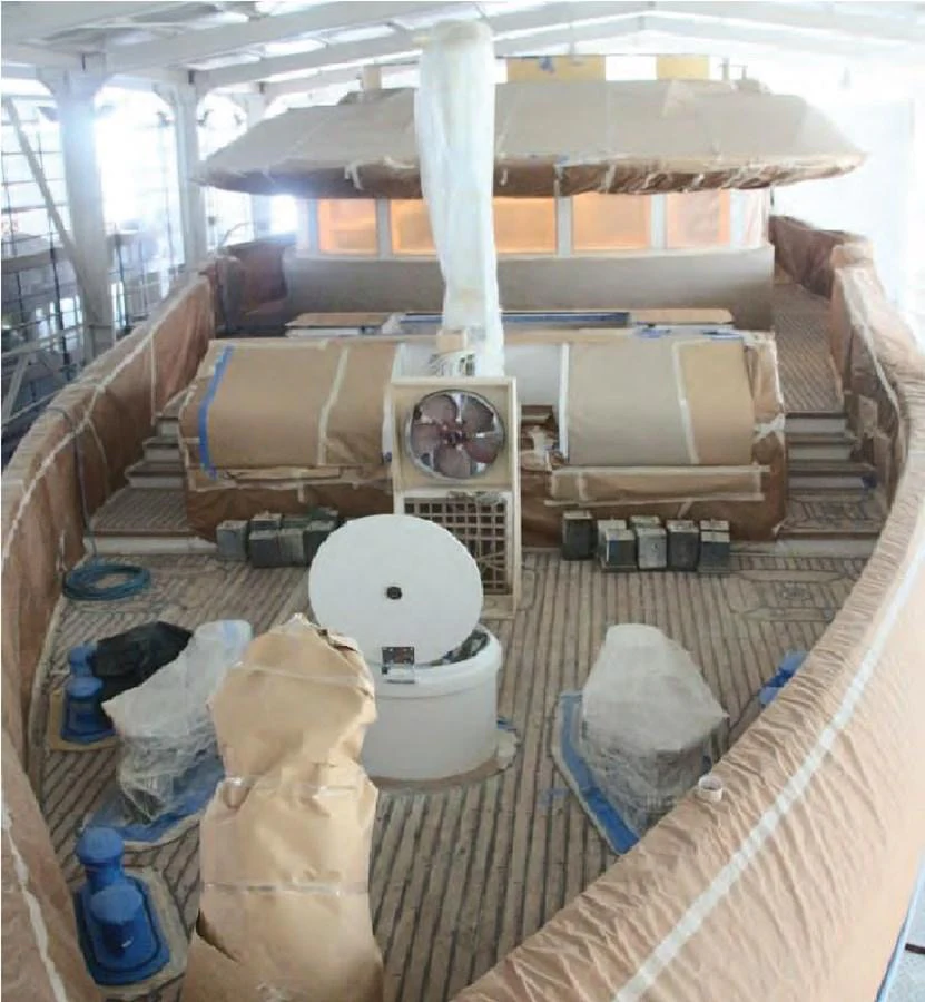 a room with a large bed and a large white tent aboard HULL#05 Yacht for Sale