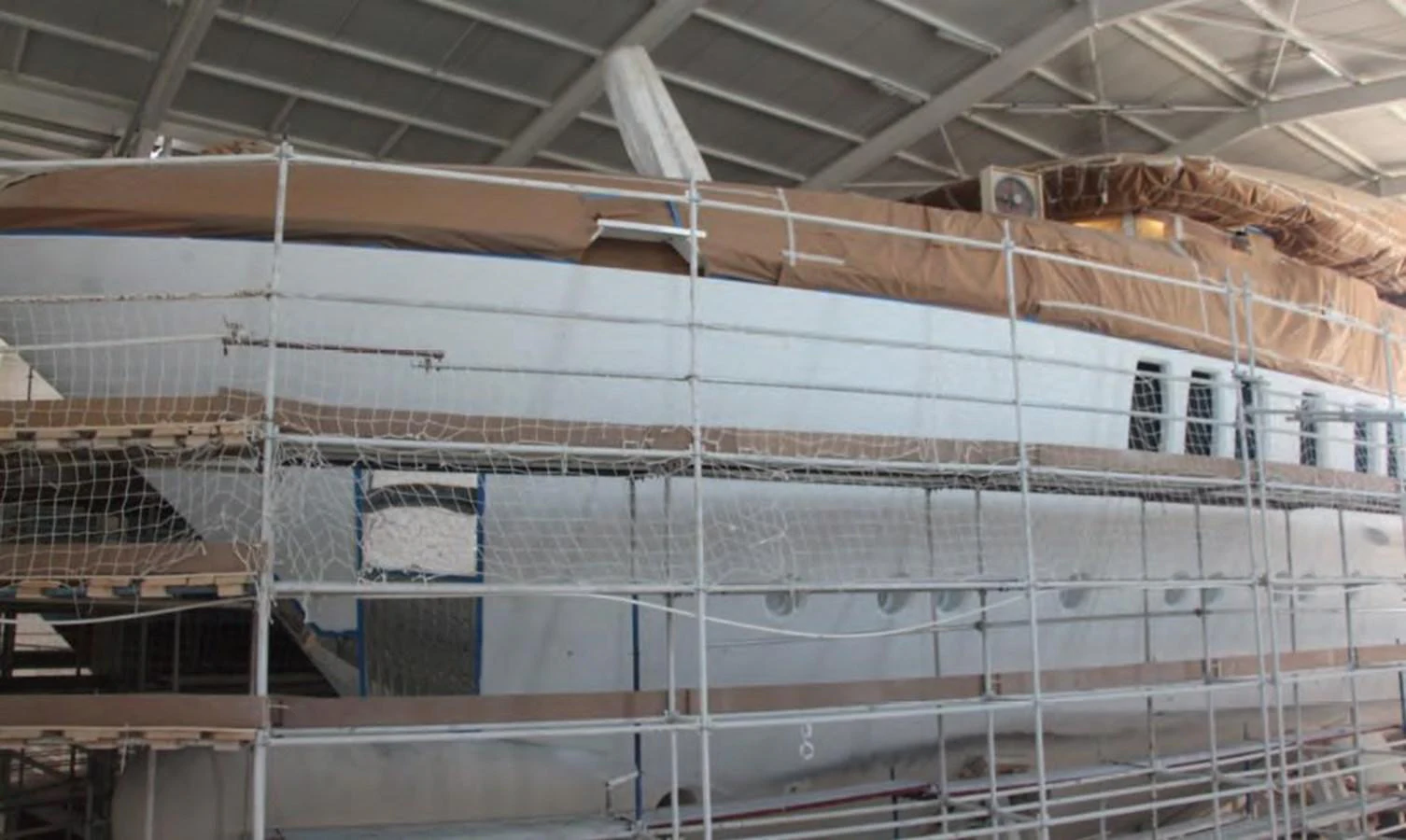 a building with many windows aboard HULL#05 Yacht for Sale