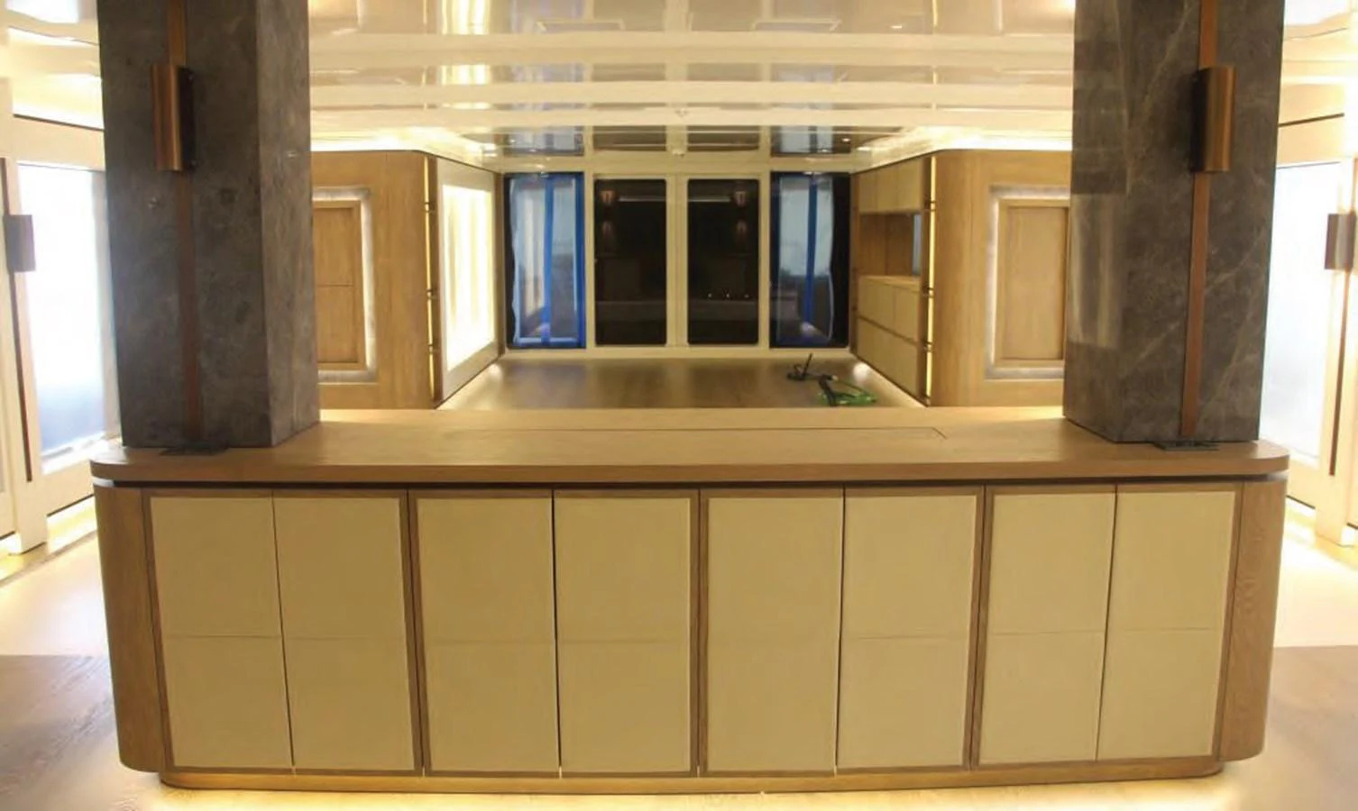 a room with cabinets and a table aboard HULL#05 Yacht for Sale