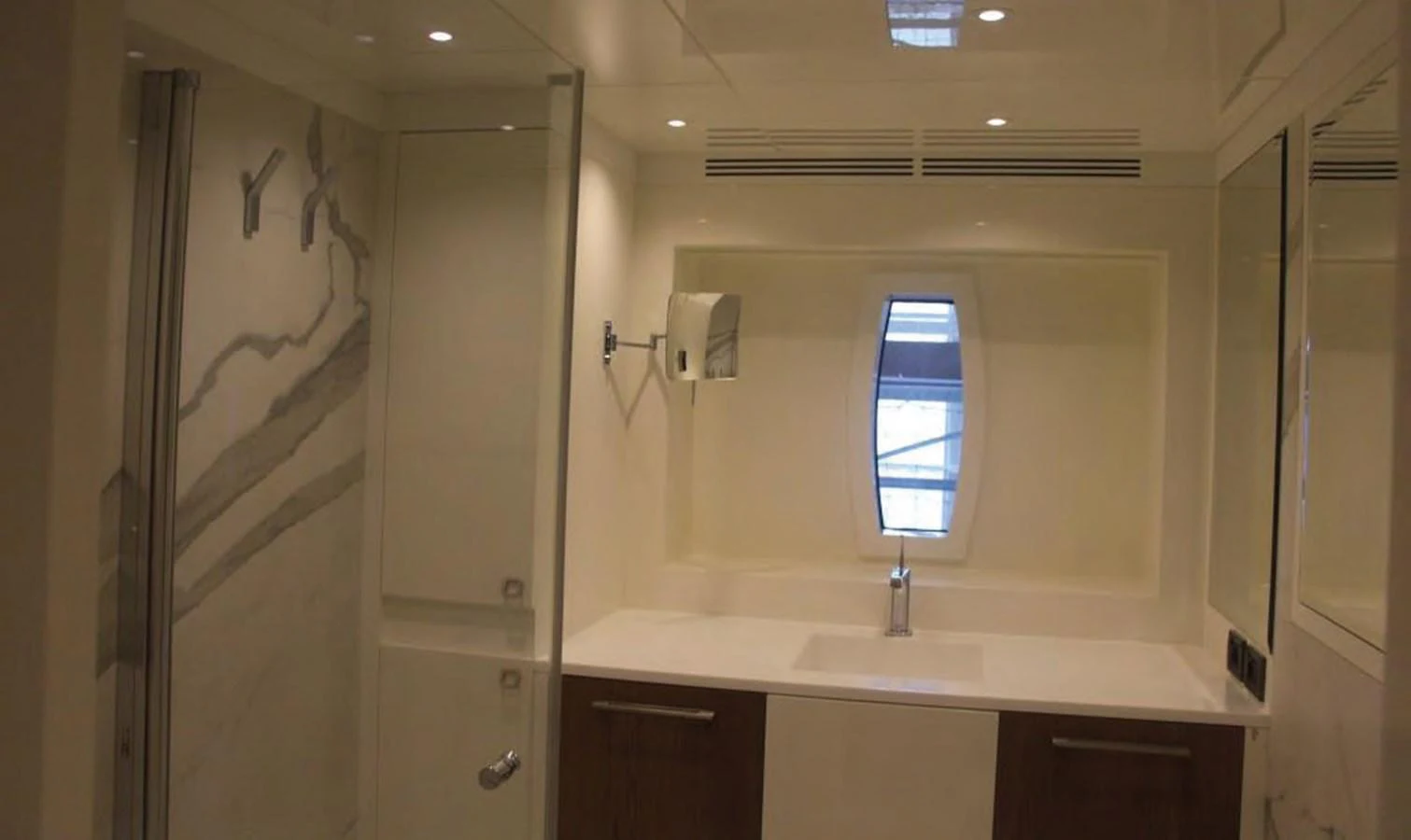 a bathroom with a sink and a shower unit aboard HULL#05 Yacht for Sale