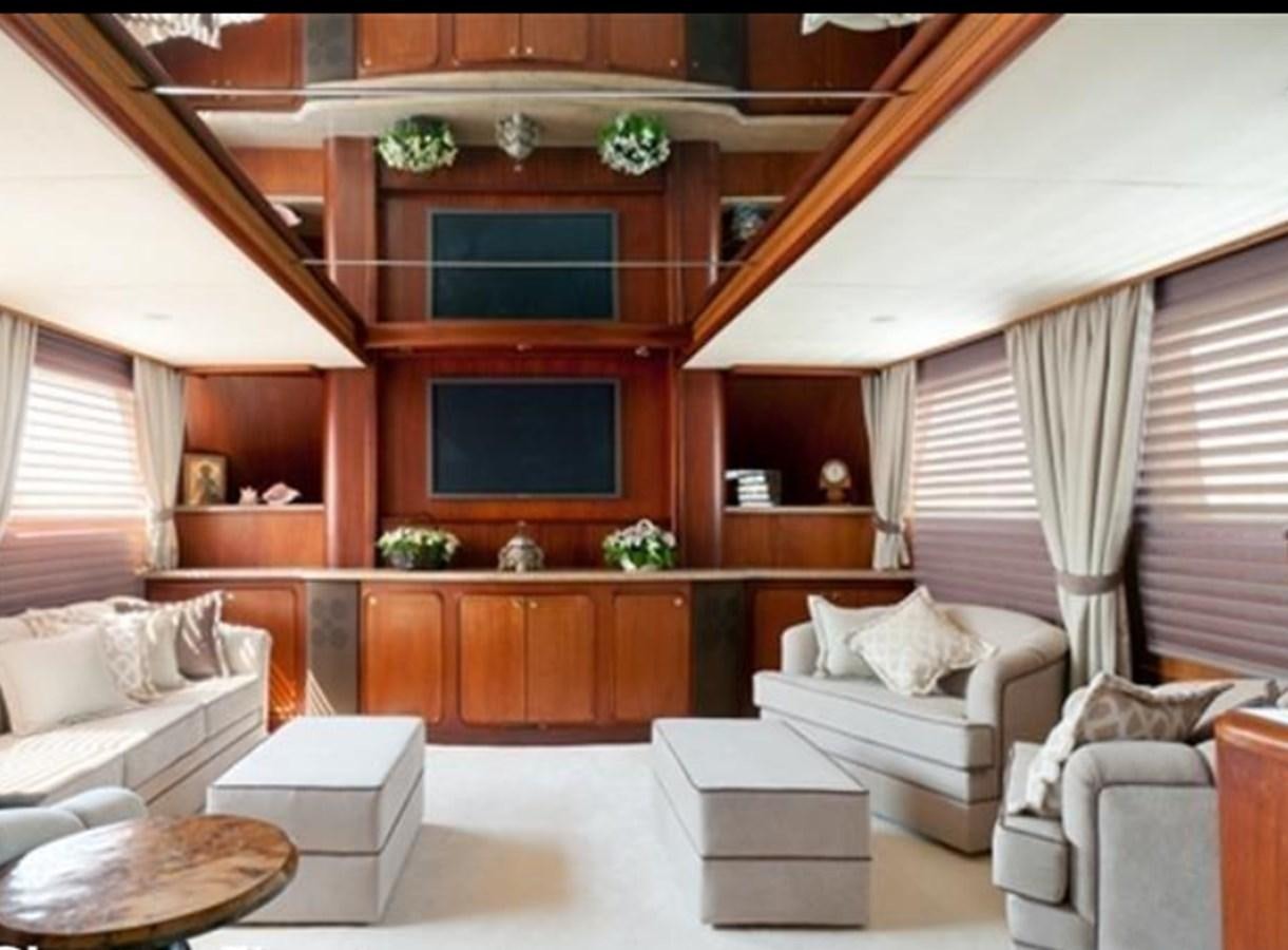 a room with a couch and a fireplace aboard AGA 6 Yacht for Sale