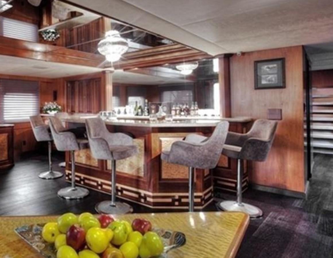 a kitchen with a table and chairs aboard AGA 6 Yacht for Sale