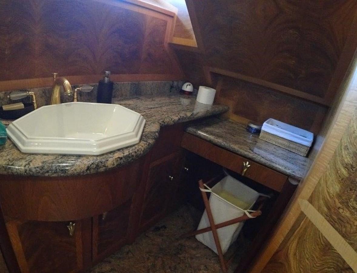 a bathroom with a sink and a mirror aboard AGA 6 Yacht for Sale