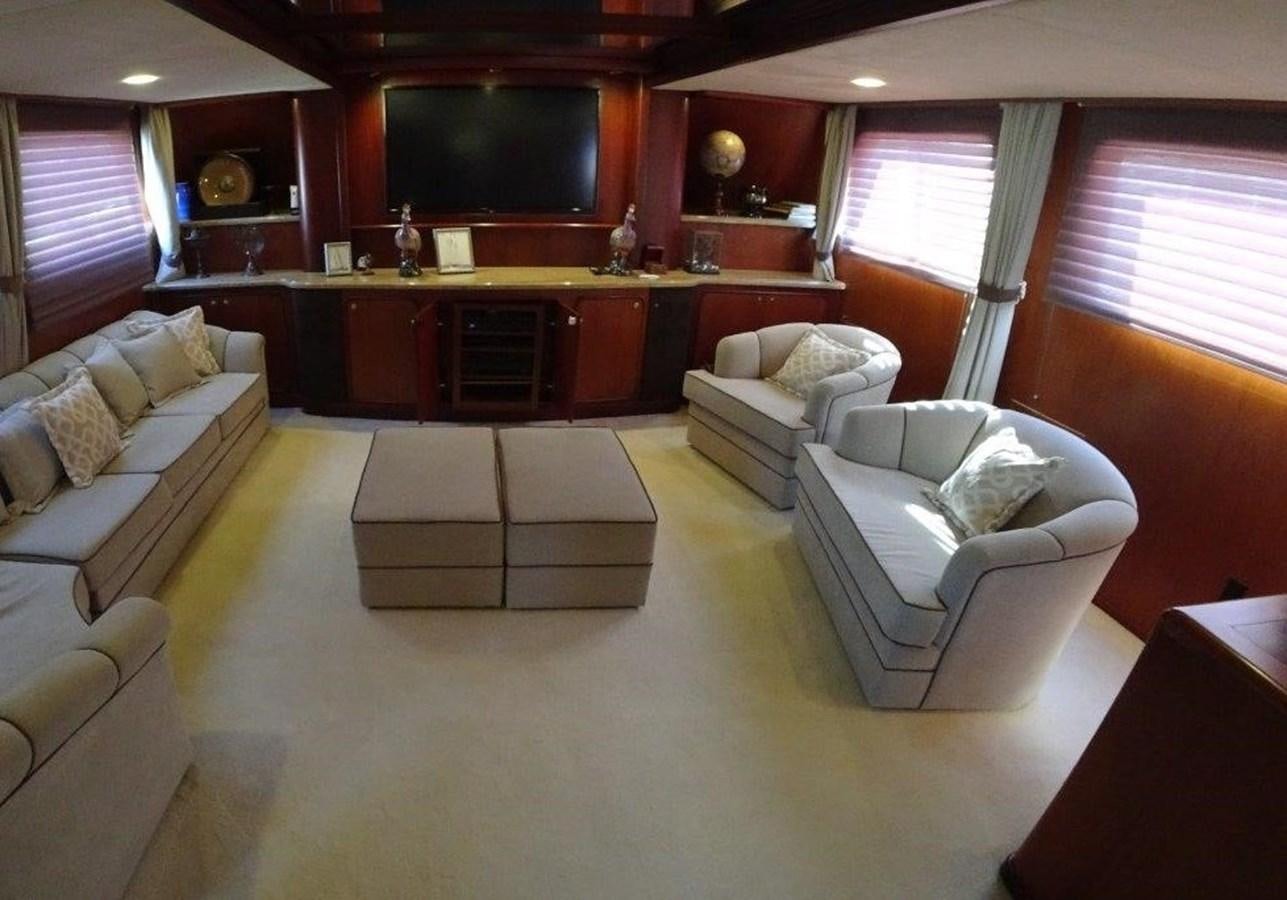 a living room with a couch and a tv aboard AGA 6 Yacht for Sale