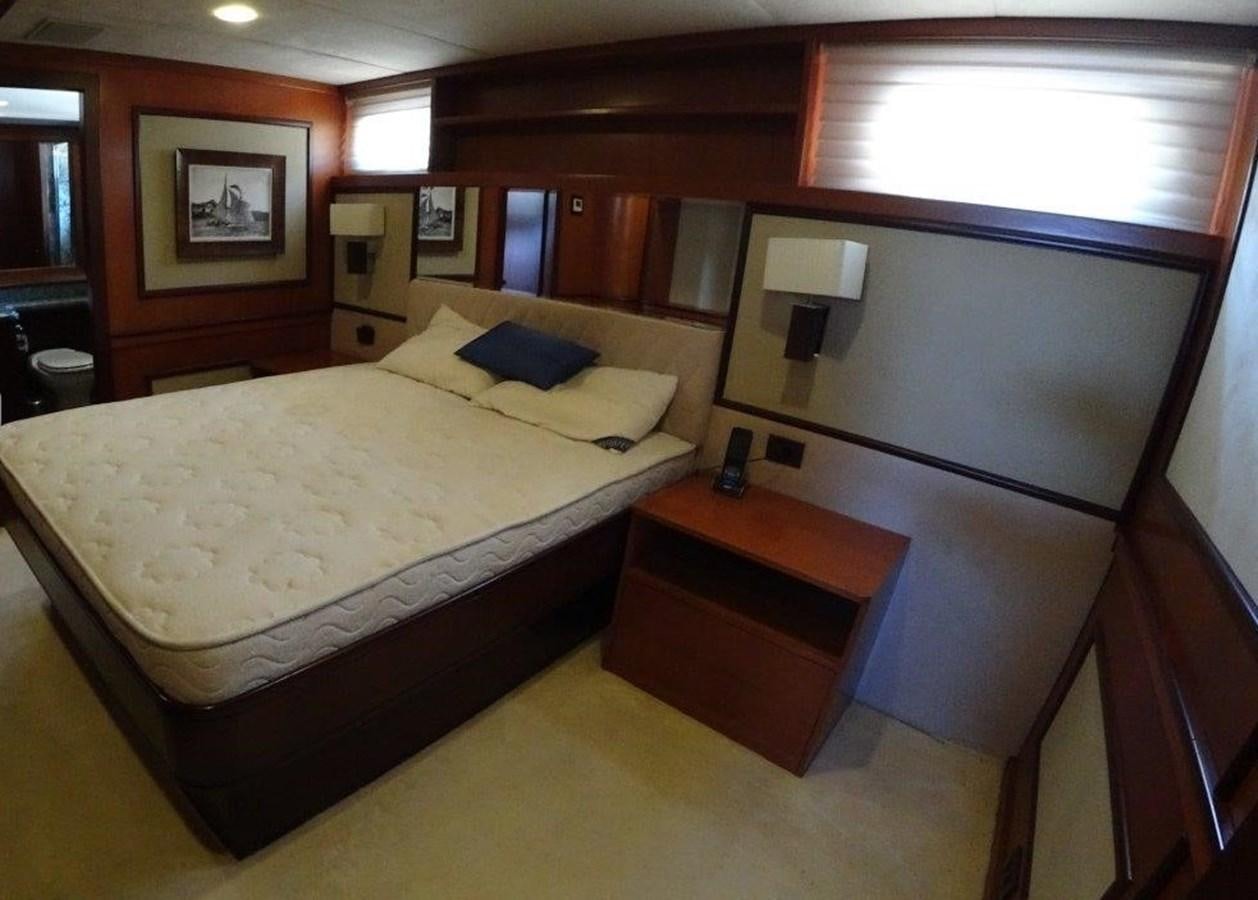 a hotel room with a bed and desk aboard AGA 6 Yacht for Sale