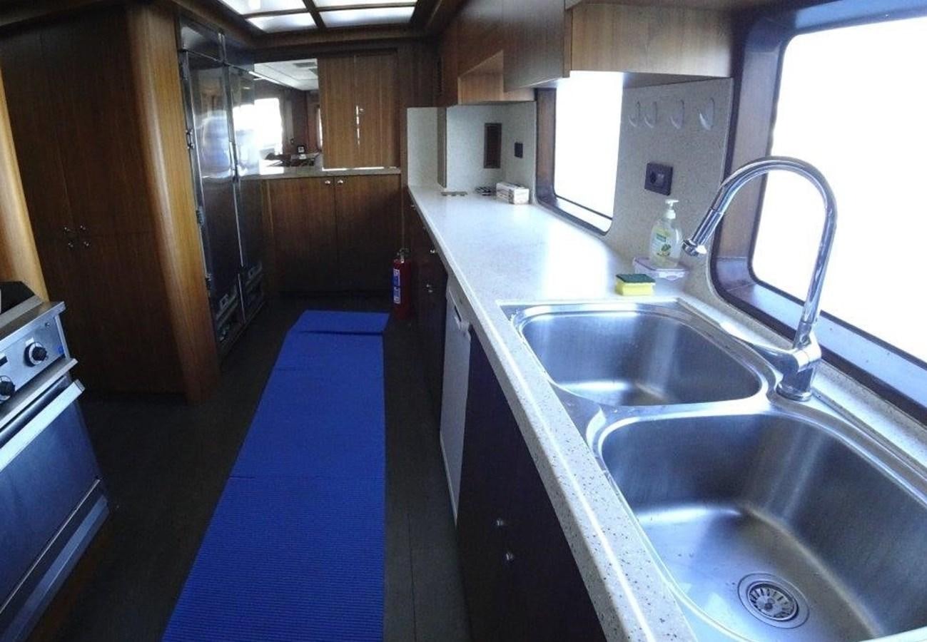 a kitchen with a sink and a stove aboard AGA 6 Yacht for Sale