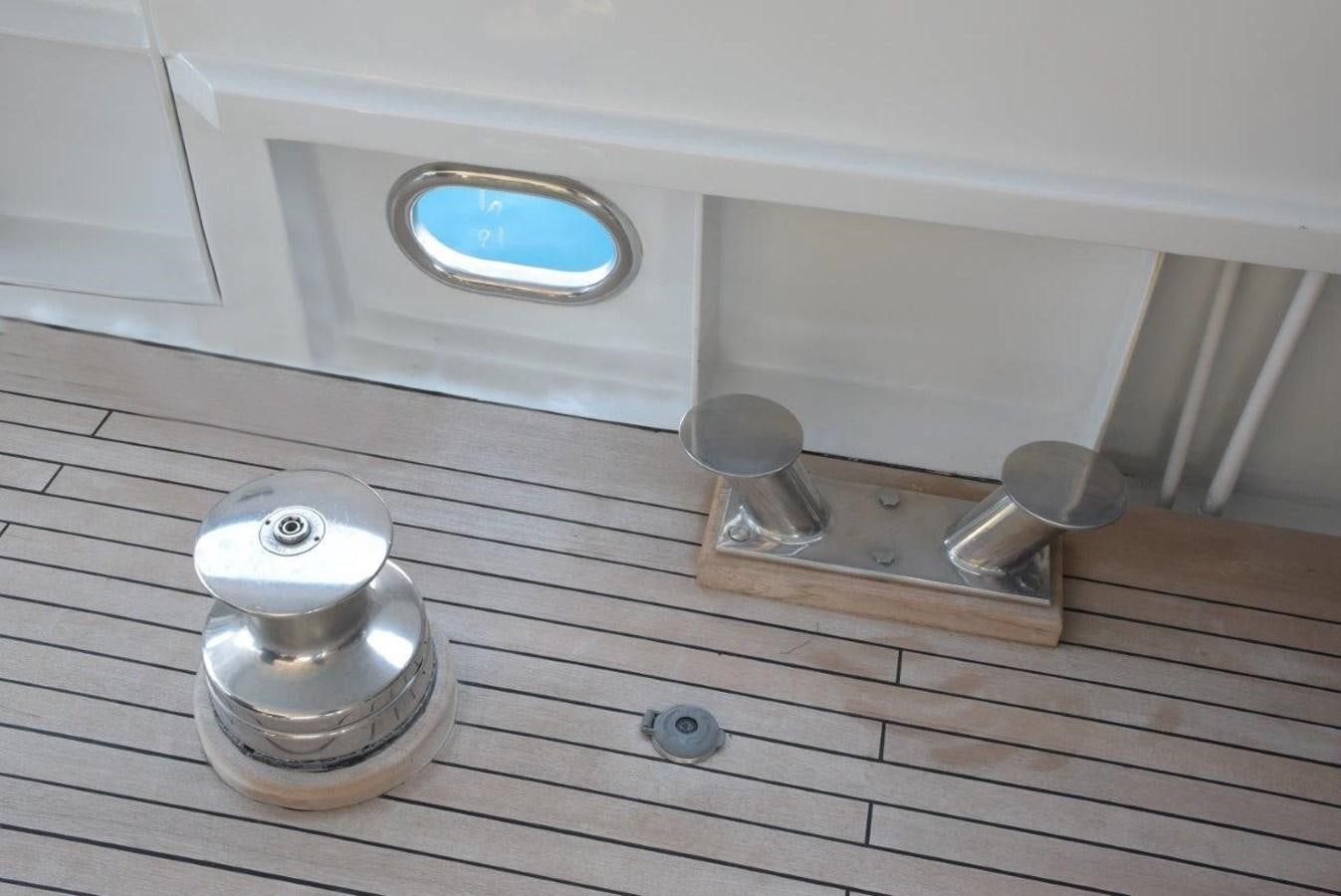 a white and silver object on a wooden surface aboard AGA 6 Yacht for Sale