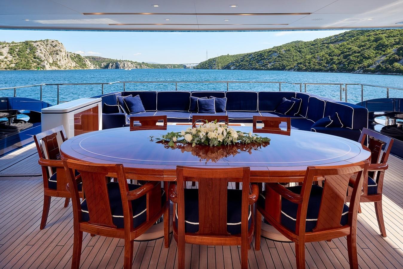 a table with a plant on top of it aboard REVE D’OR Yacht for Sale