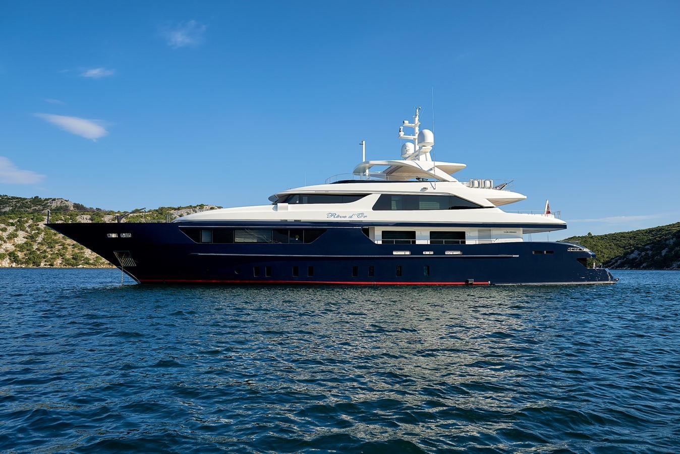 a large boat in the water aboard REVE D’OR Yacht for Sale