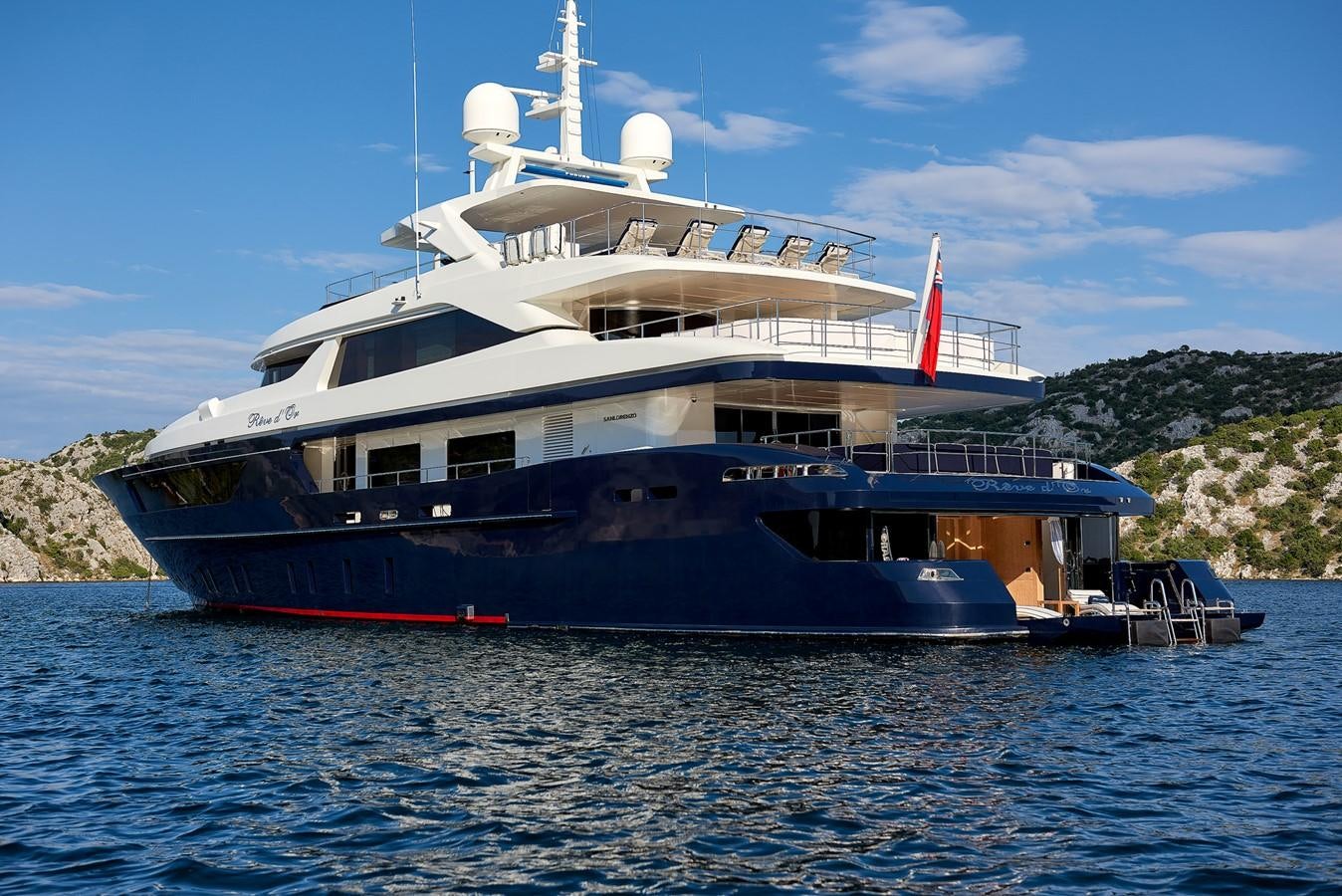 a large boat in the water aboard REVE D’OR Yacht for Sale