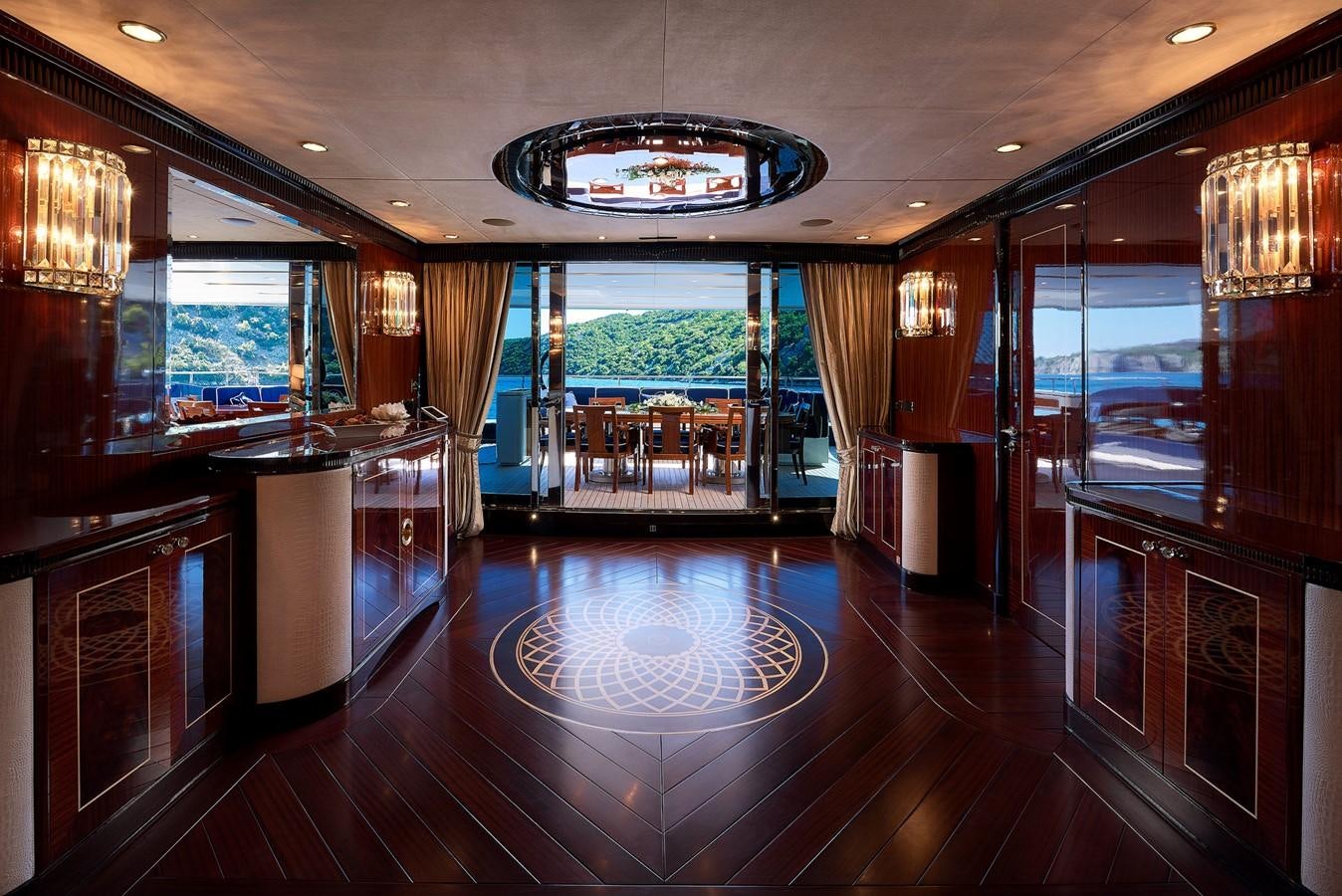 a large kitchen with a large glass door aboard REVE D’OR Yacht for Sale