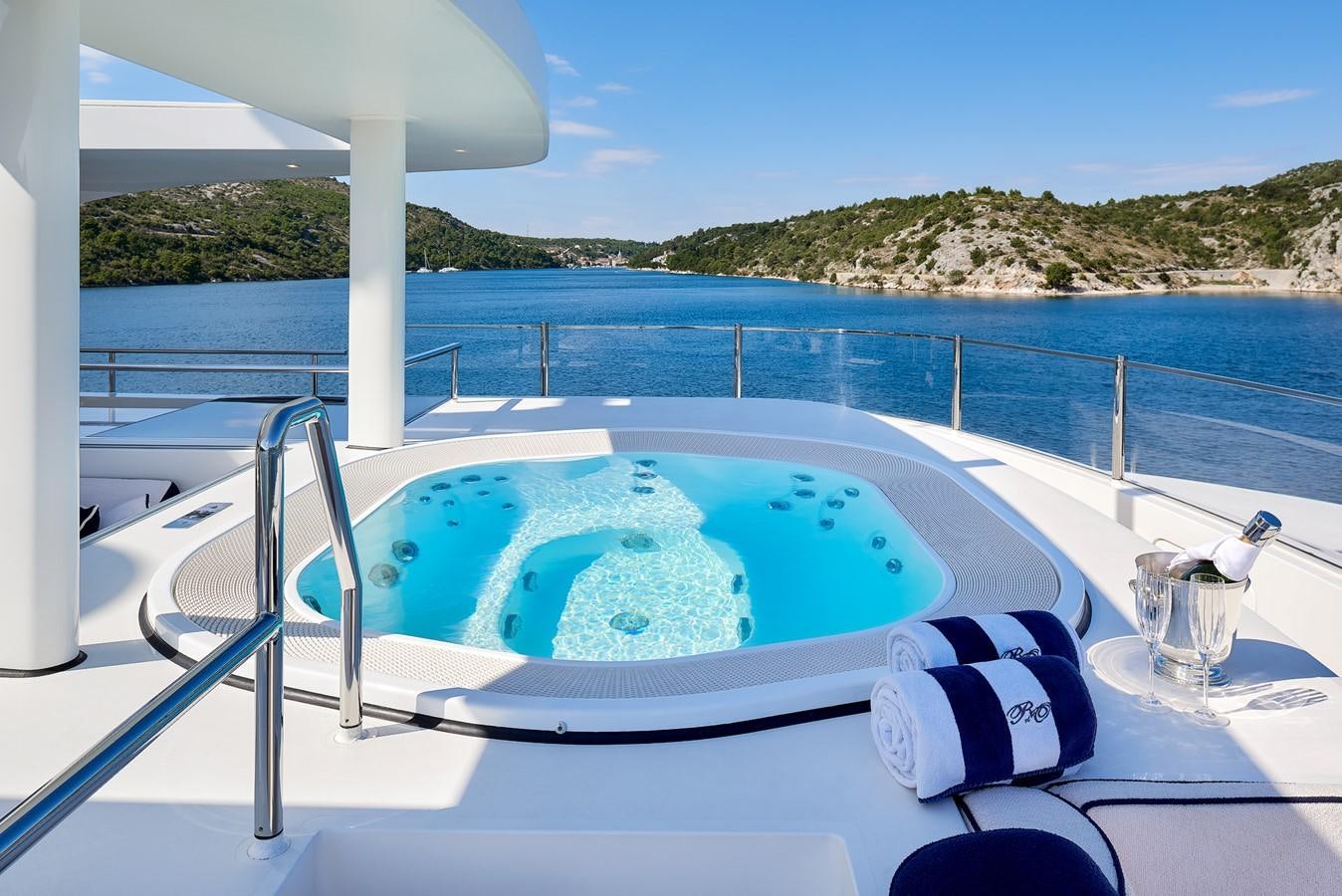 a pool on a deck aboard REVE D’OR Yacht for Sale