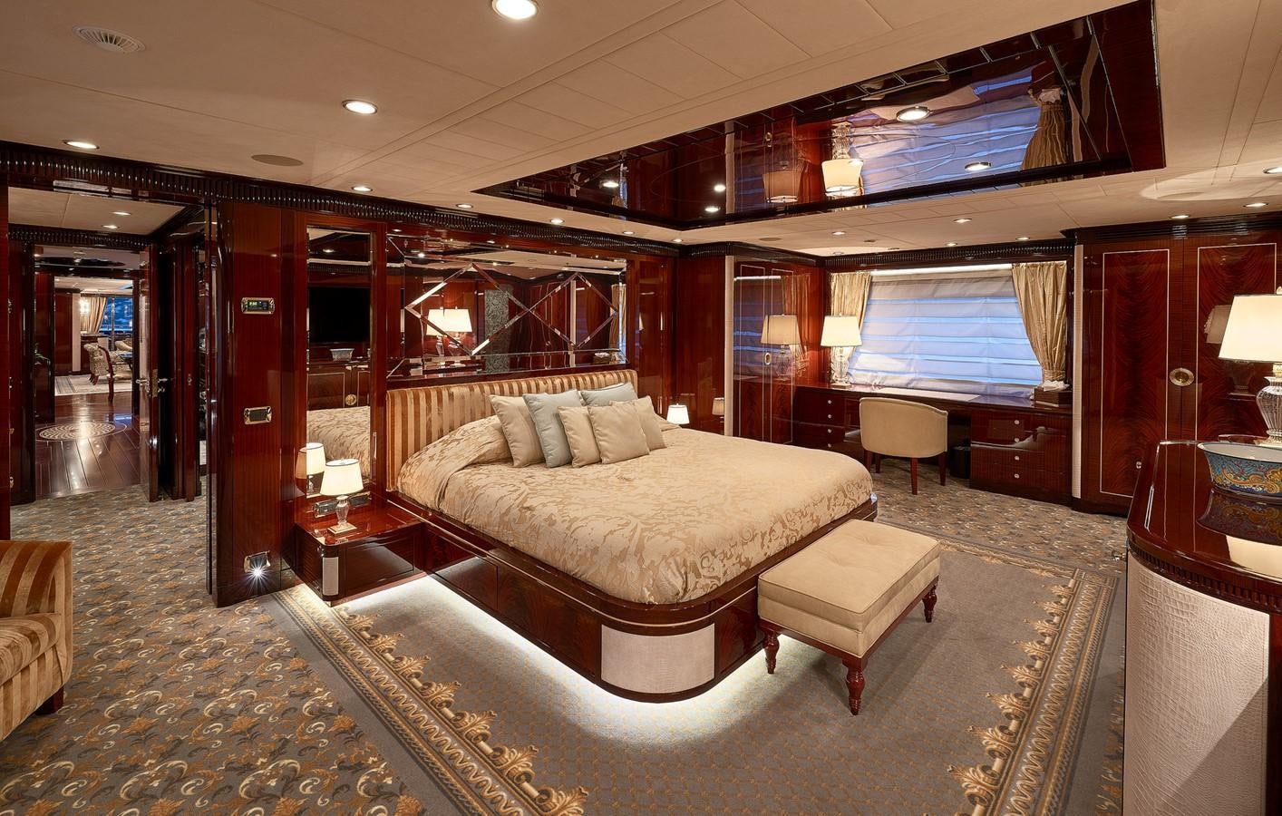 a room with a bed and a couch aboard REVE D’OR Yacht for Sale