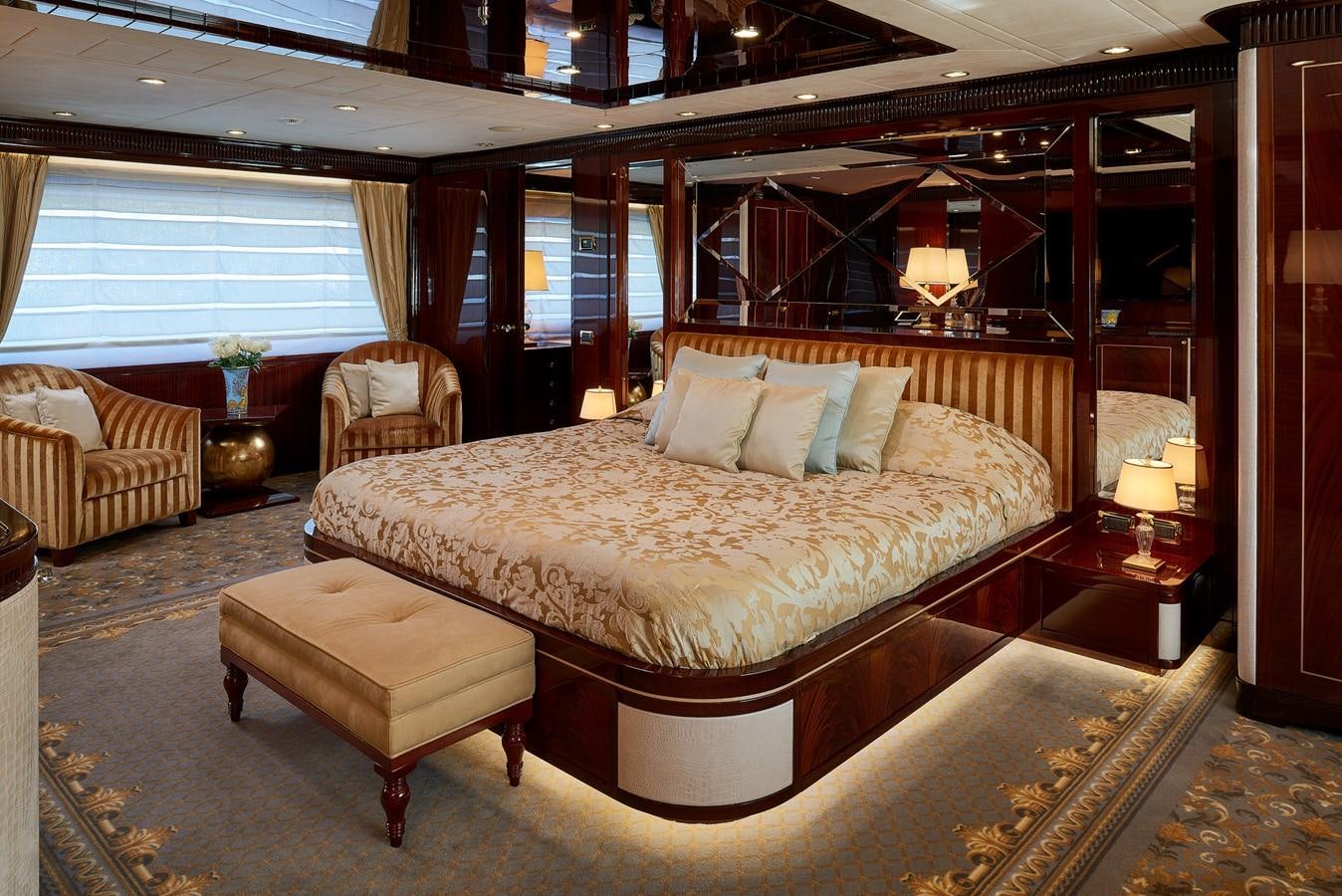 a large bed in a room aboard REVE D’OR Yacht for Sale