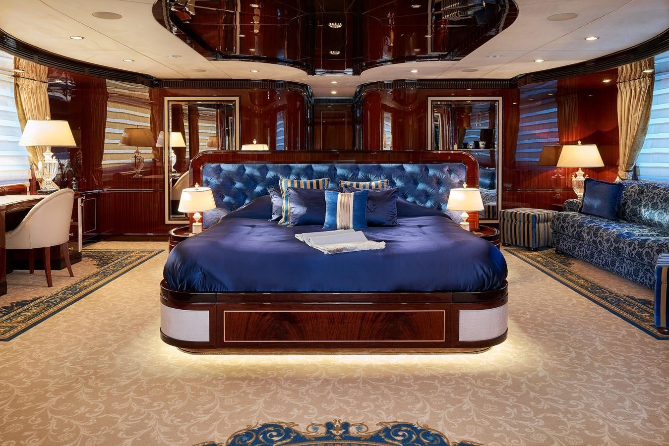 a large bed in a room aboard REVE D’OR Yacht for Sale