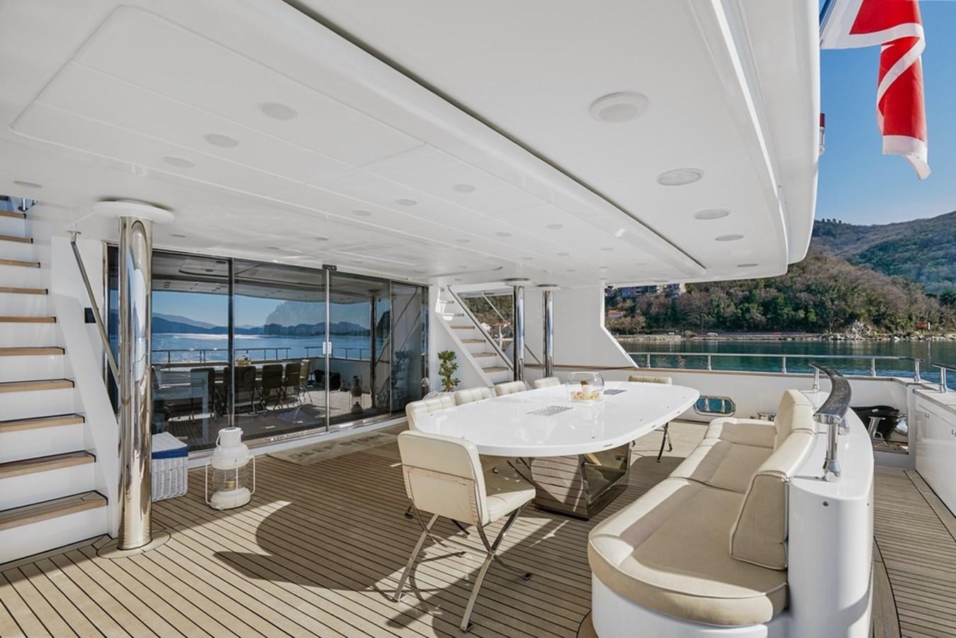 a room with a table and chairs aboard DEEP STORY Yacht for Sale