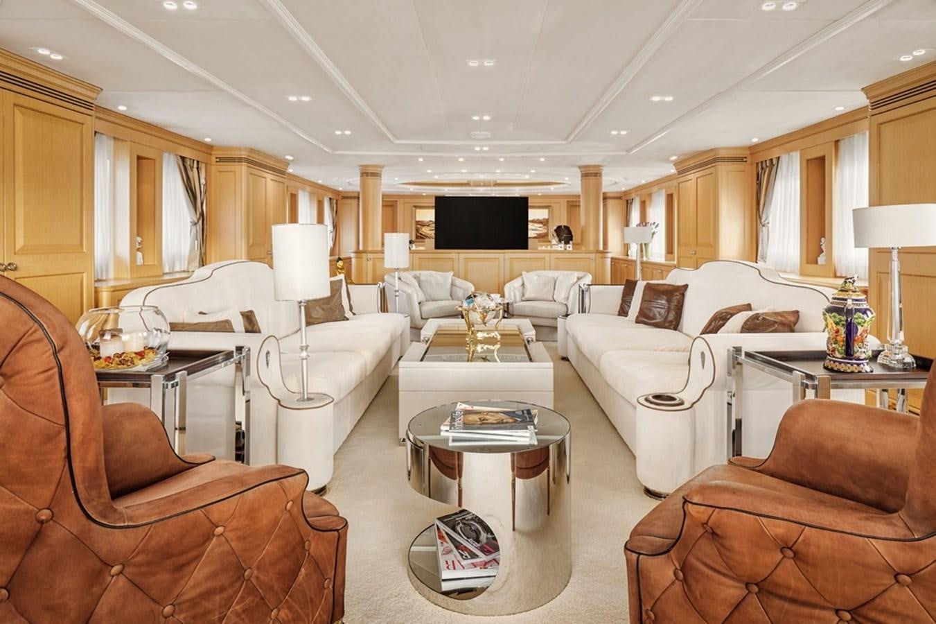 a living room with a couch and a coffee table aboard DEEP STORY Yacht for Sale