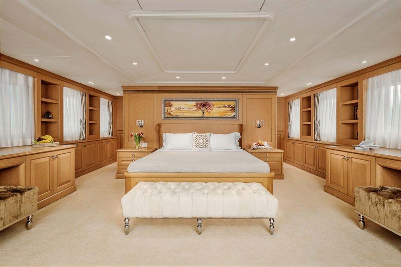 a large bedroom with a bed aboard DEEP STORY Yacht for Sale