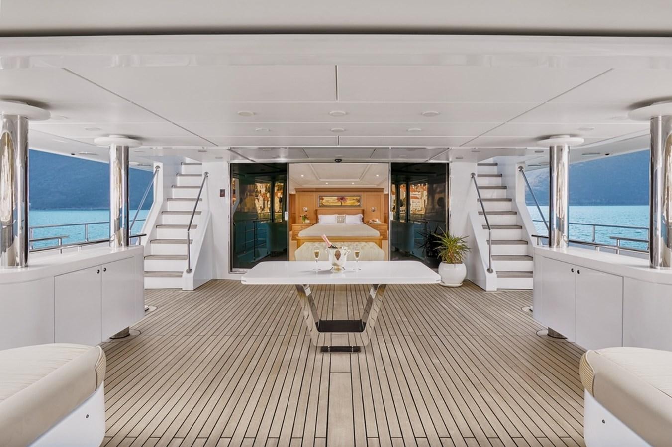 a room with a table and chairs aboard DEEP STORY Yacht for Sale