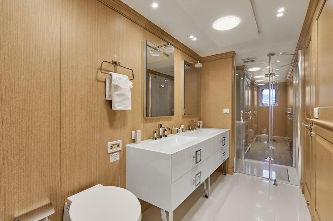 a bathroom with a glass shower aboard DEEP STORY Yacht for Sale