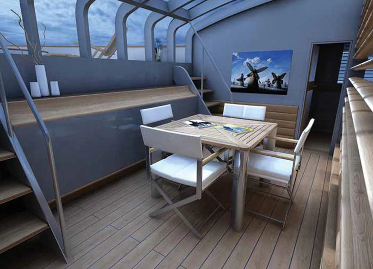 a table and chairs on a deck aboard SM45  AMERIGO Yacht for Sale