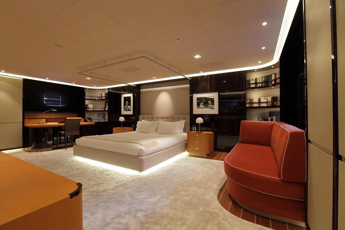a large living room with a large screen aboard SERENDIPITY I Yacht for Sale