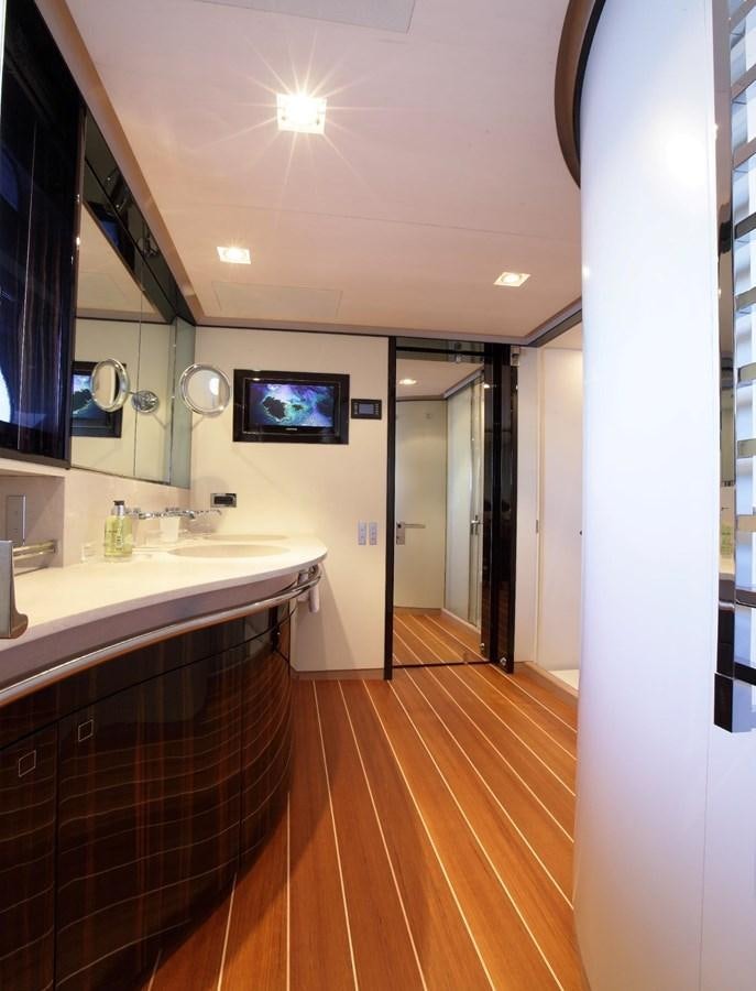 a bathroom with a large mirror aboard SERENDIPITY I Yacht for Sale