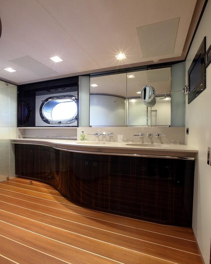 a large bathroom with a large mirror aboard SERENDIPITY I Yacht for Sale
