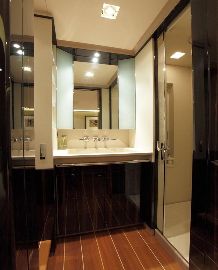 a bathroom with a sink and a mirror aboard SERENDIPITY I Yacht for Sale