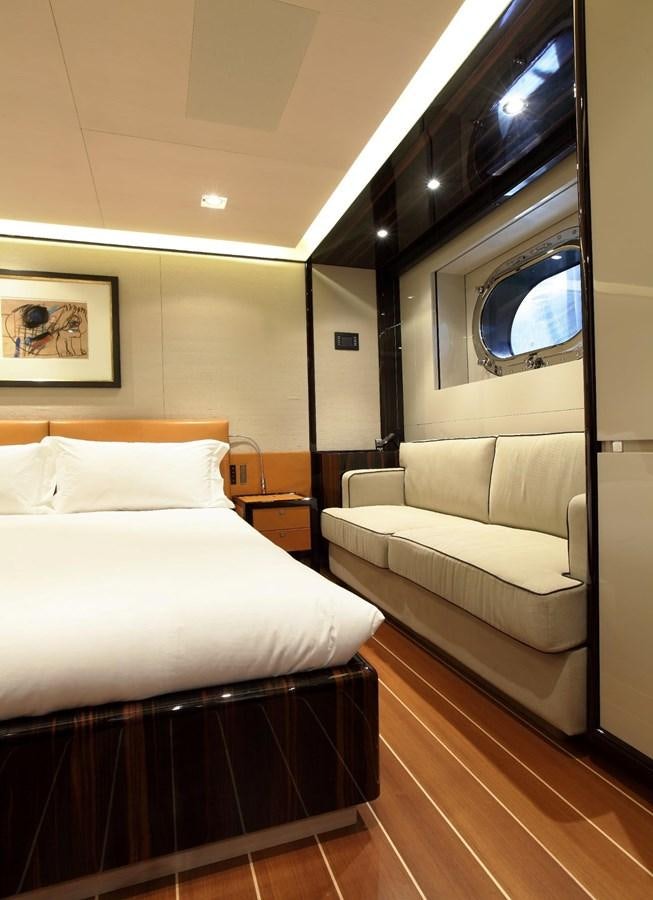 a bed and a couch in a room aboard SERENDIPITY I Yacht for Sale