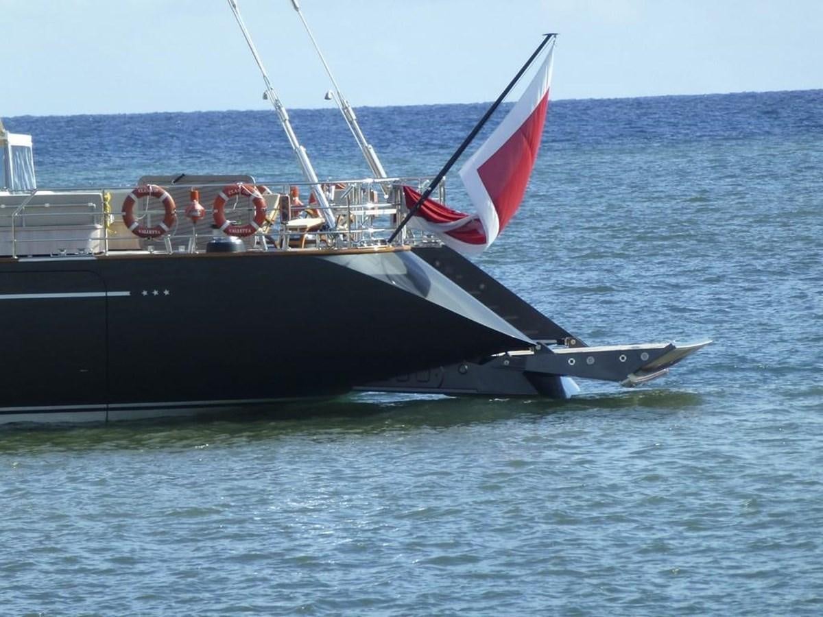 a large black and red sailboat aboard SERENDIPITY I Yacht for Sale