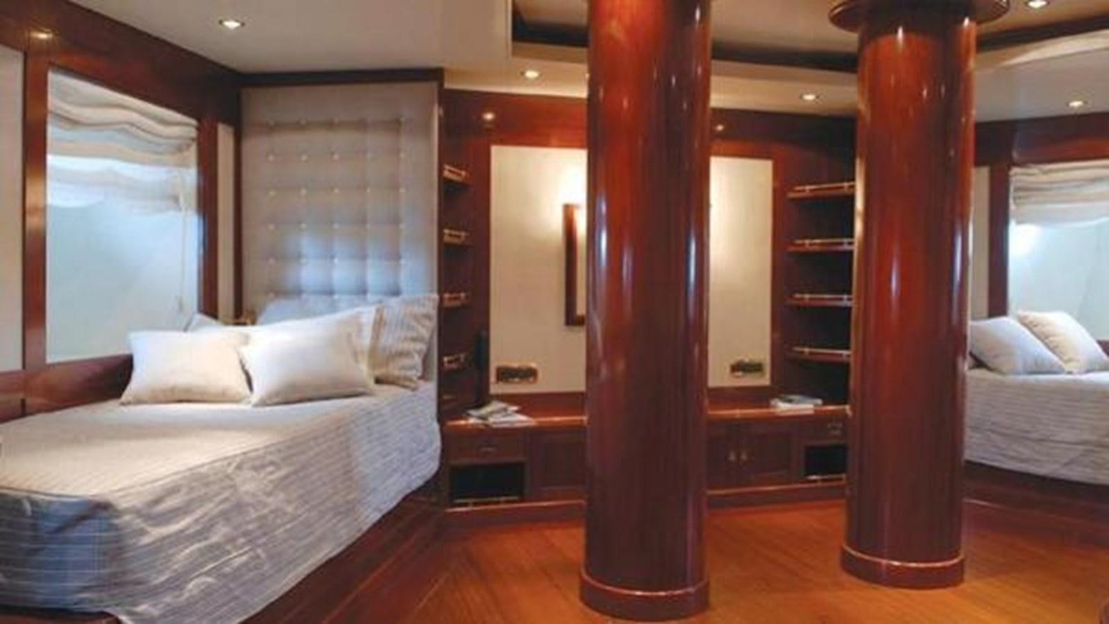 a room with a bed and a mirror aboard ARIETE PRIMO Yacht for Sale