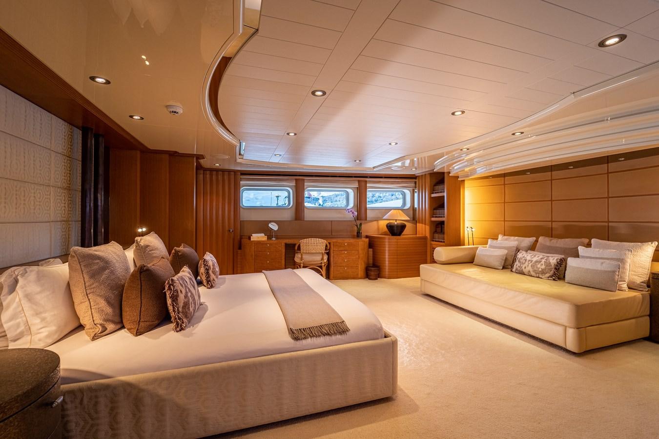 a room with a couch and a tv on the wall aboard KIJO Yacht for Charter