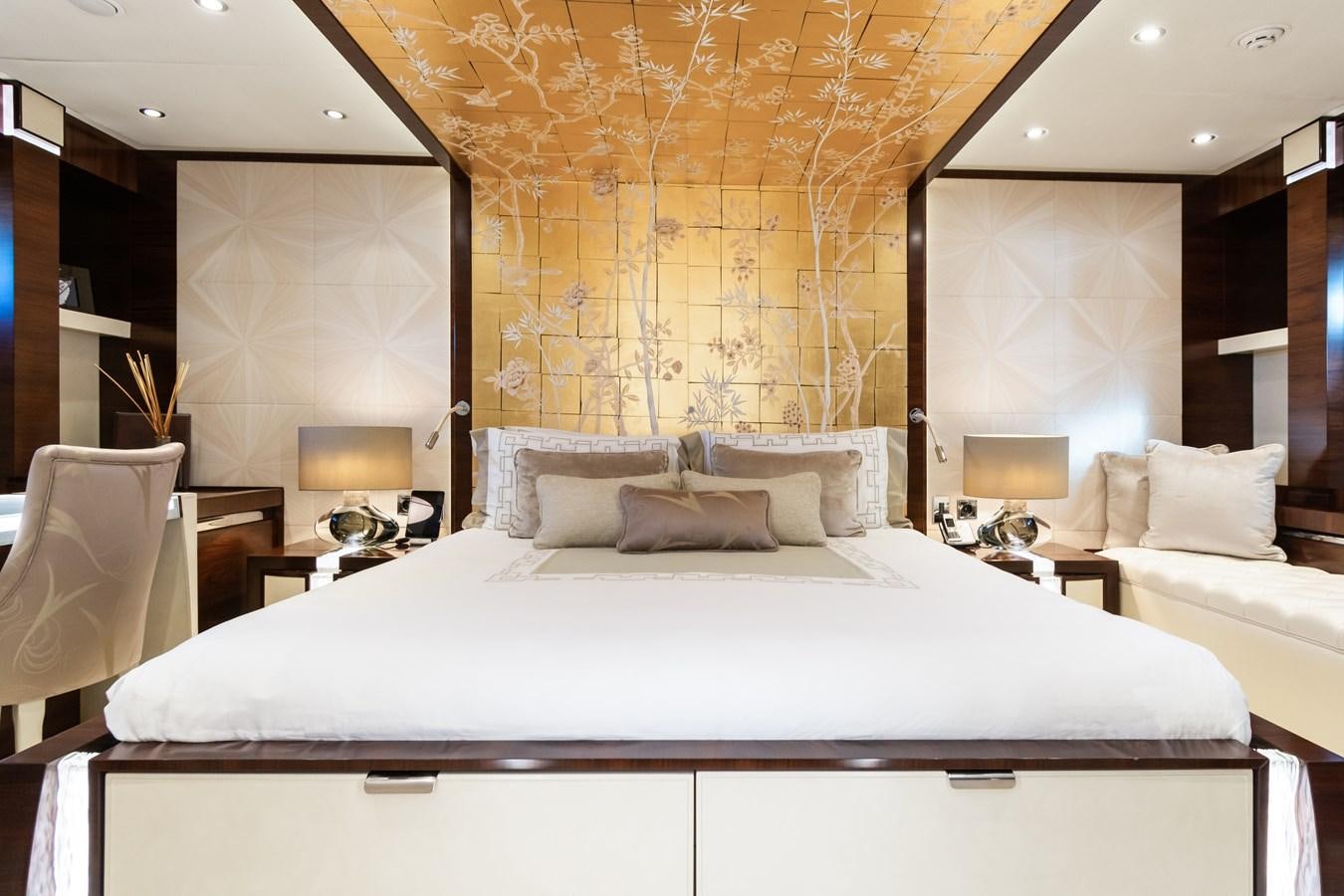 a large bed with a white bed spread aboard SILVER WIND Yacht for Sale