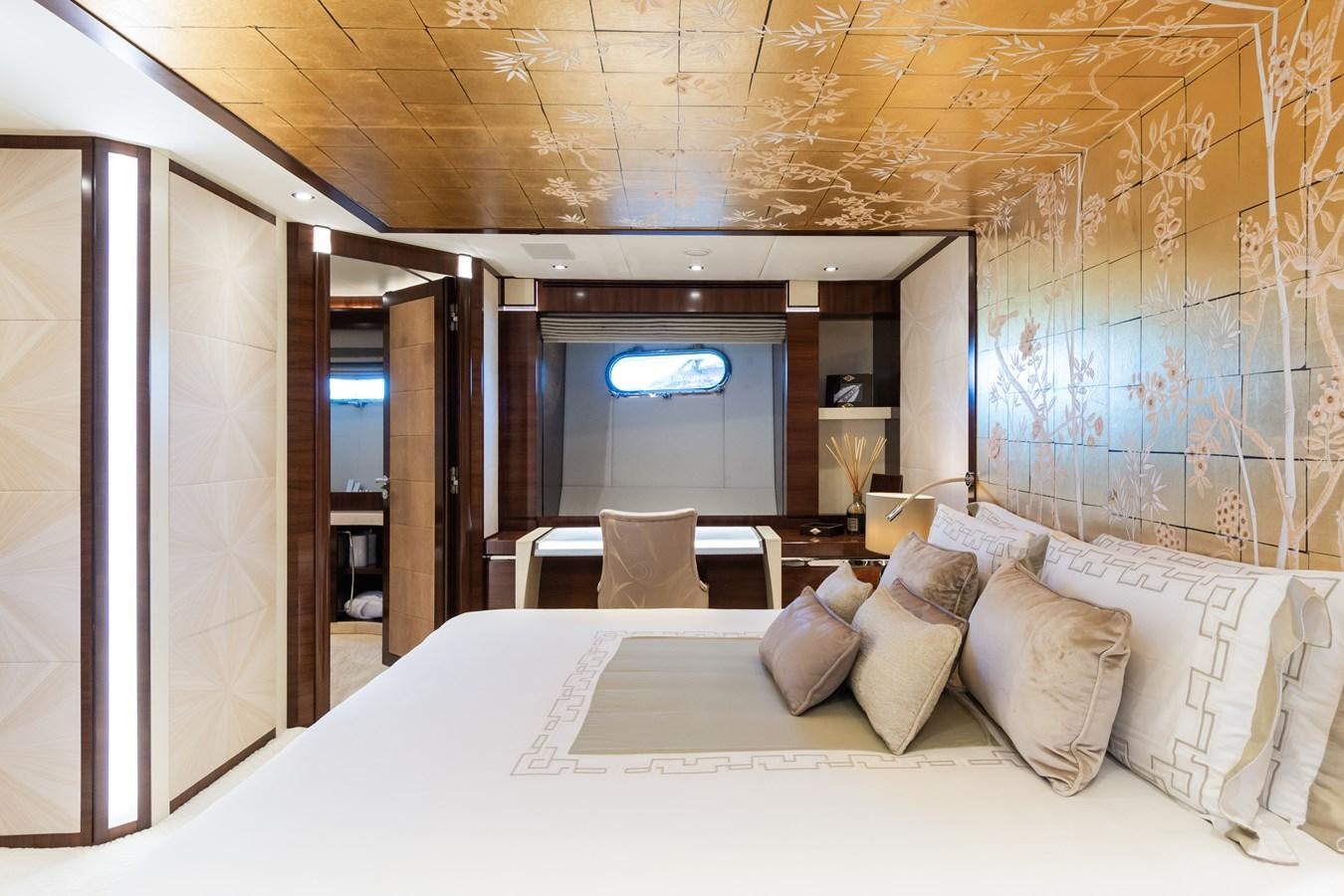 a bed with pillows and a television aboard SILVER WIND Yacht for Sale