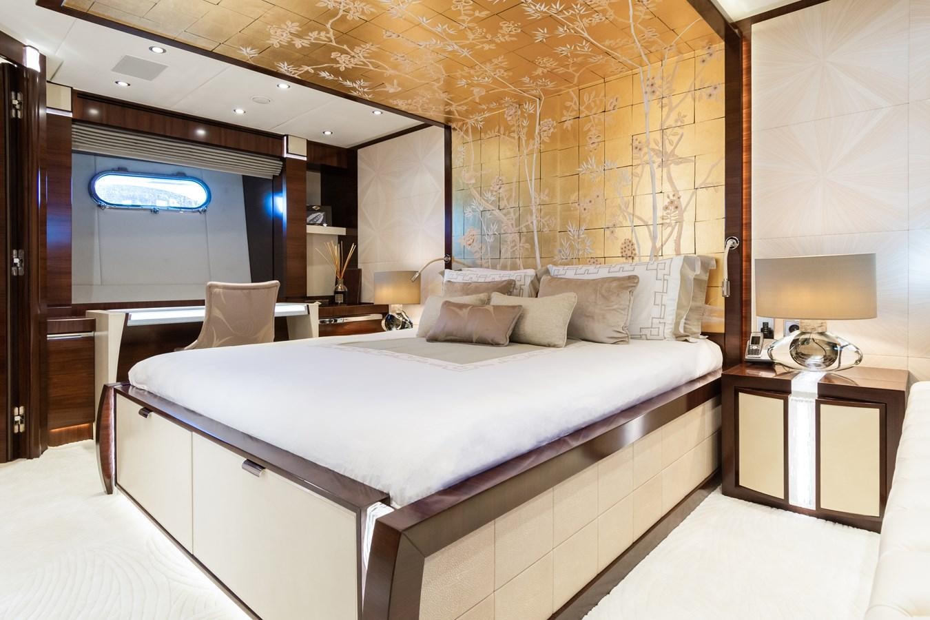 a bed with a white bed spread aboard SILVER WIND Yacht for Sale