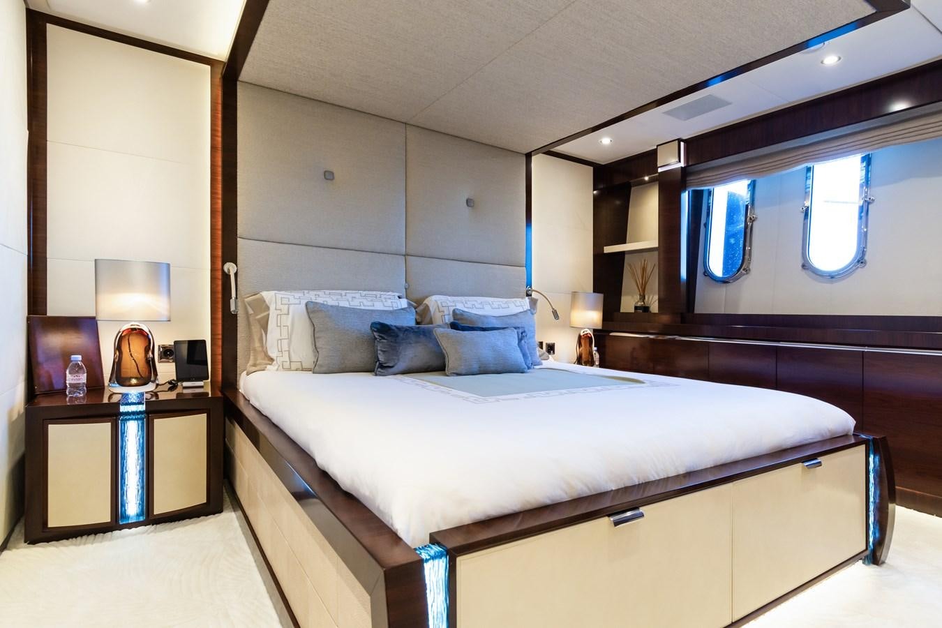 a bedroom with a bed and a desk aboard SILVER WIND Yacht for Sale
