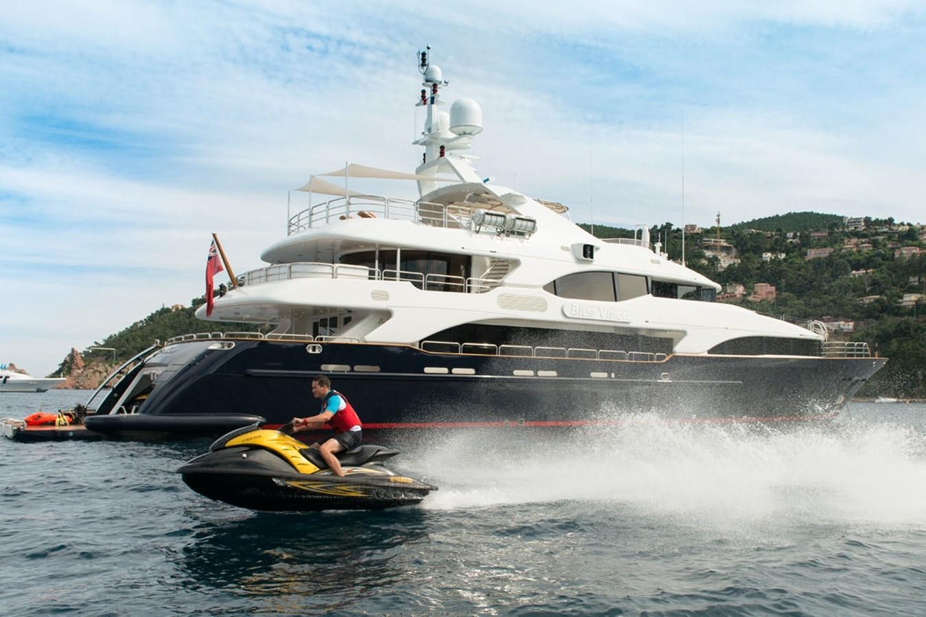 a man on a boat in the water aboard BLUE VISION Yacht for Sale