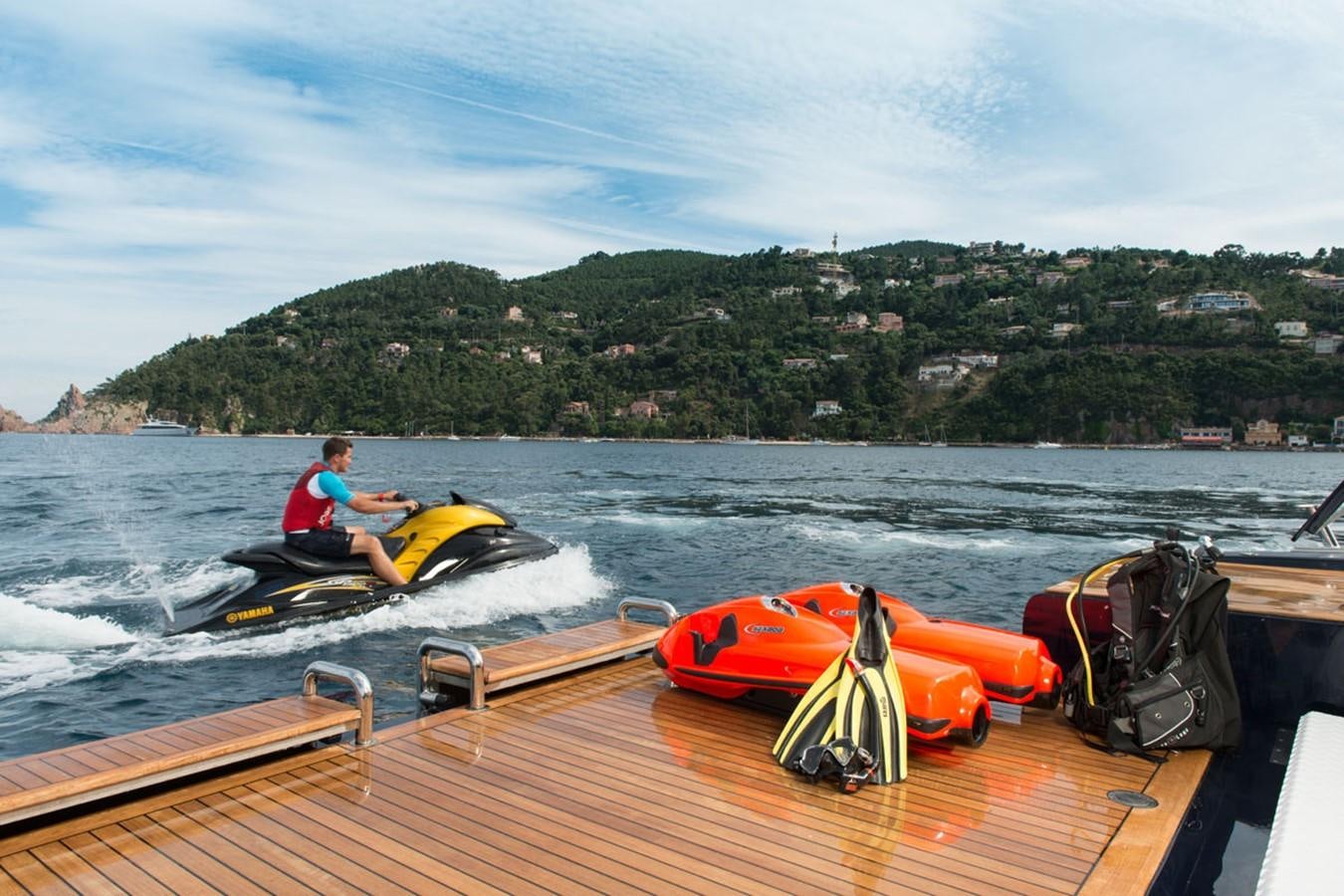 a person on a boat in the water with a life vest on aboard BLUE VISION Yacht for Sale