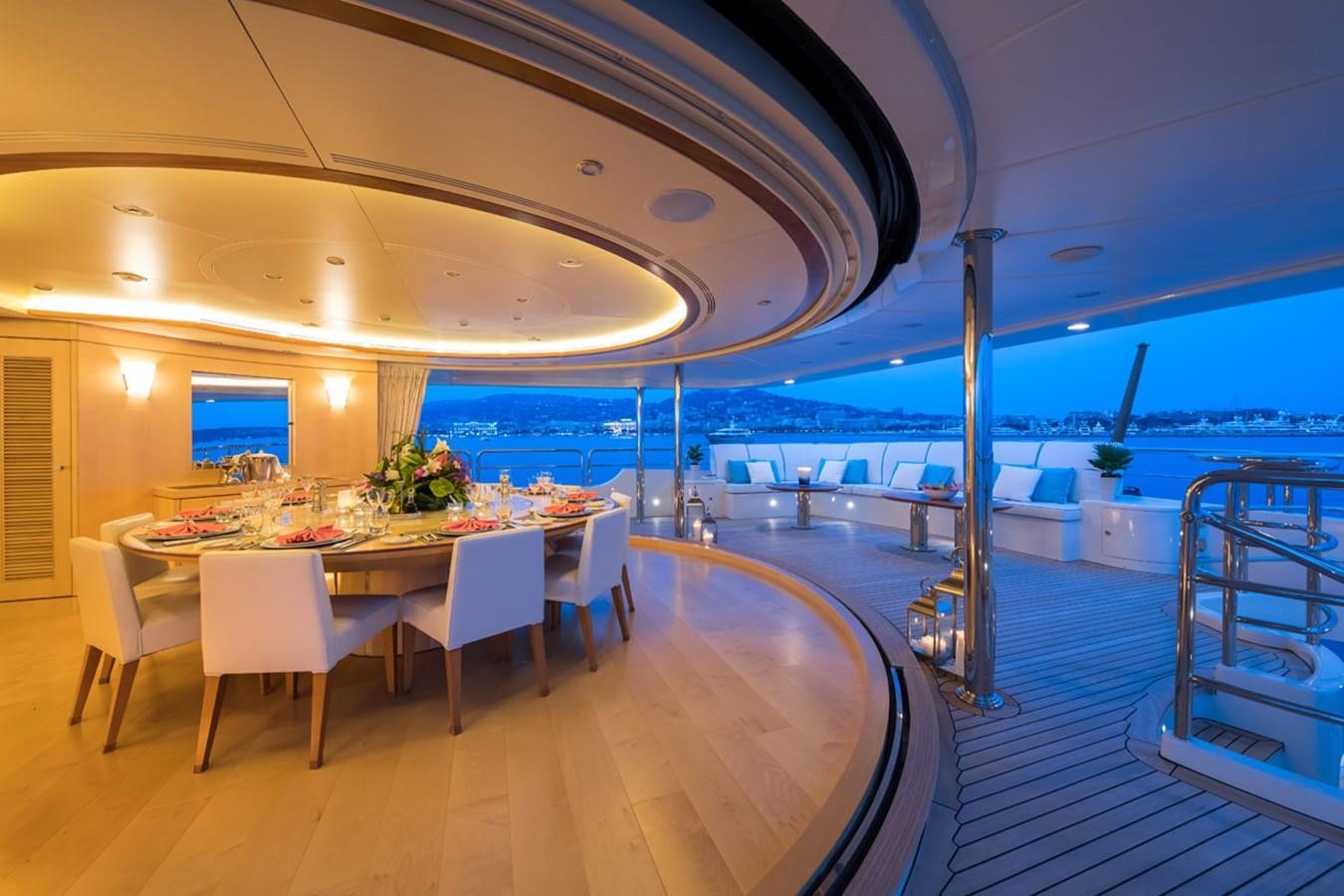 a room with tables and chairs aboard BLUE VISION Yacht for Sale