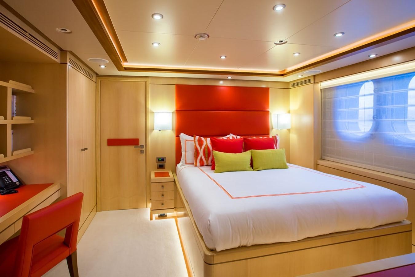 a room with a bed and a desk aboard BLUE VISION Yacht for Sale