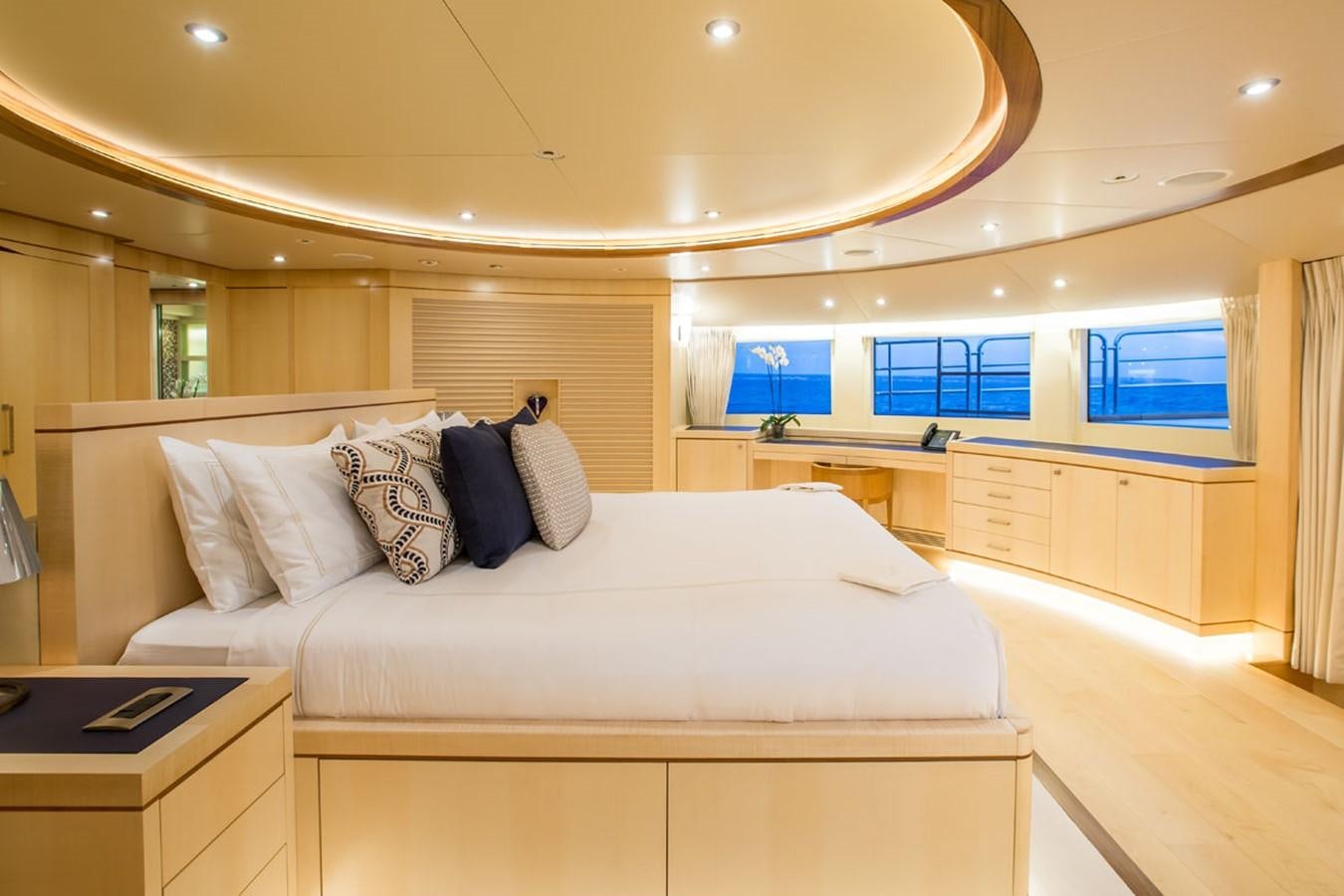 a room with a bed and a desk aboard BLUE VISION Yacht for Sale