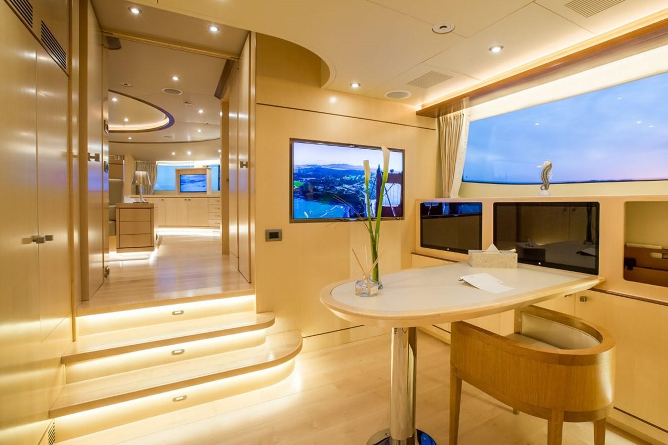 a room with a table and chairs aboard BLUE VISION Yacht for Sale