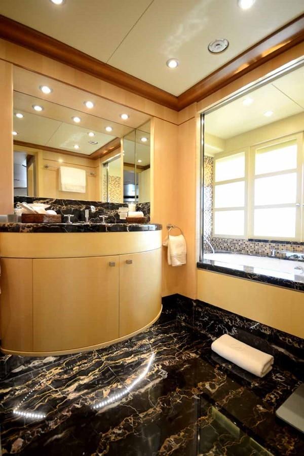 a bathroom with a large marble countertop aboard BLUE VISION Yacht for Sale